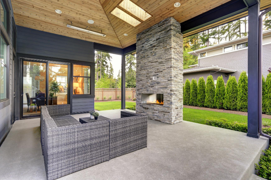 custom patio with outdoor fireplace